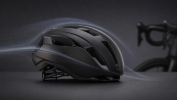 A generic black aero road helmet in a studio airflow scene