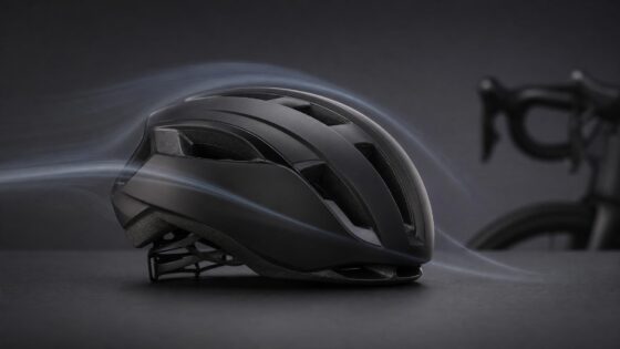 A generic black aero road helmet in a studio airflow scene