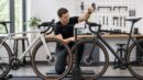 Bike fitter comparing the stack and reach of two bicycle frames.