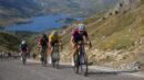 Women road cyclists climbing a mountain road during a race